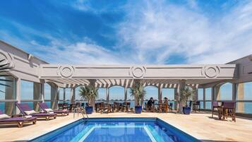 Outdoor pool, pool umbrellas, sun loungers