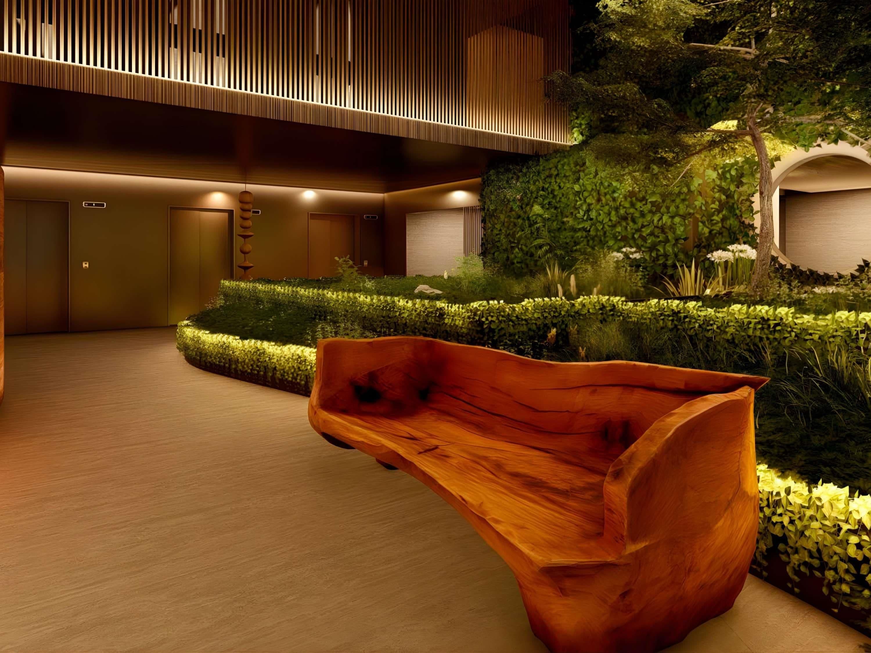 A modern interior with a wooden bench, a reception area, and a green garden.