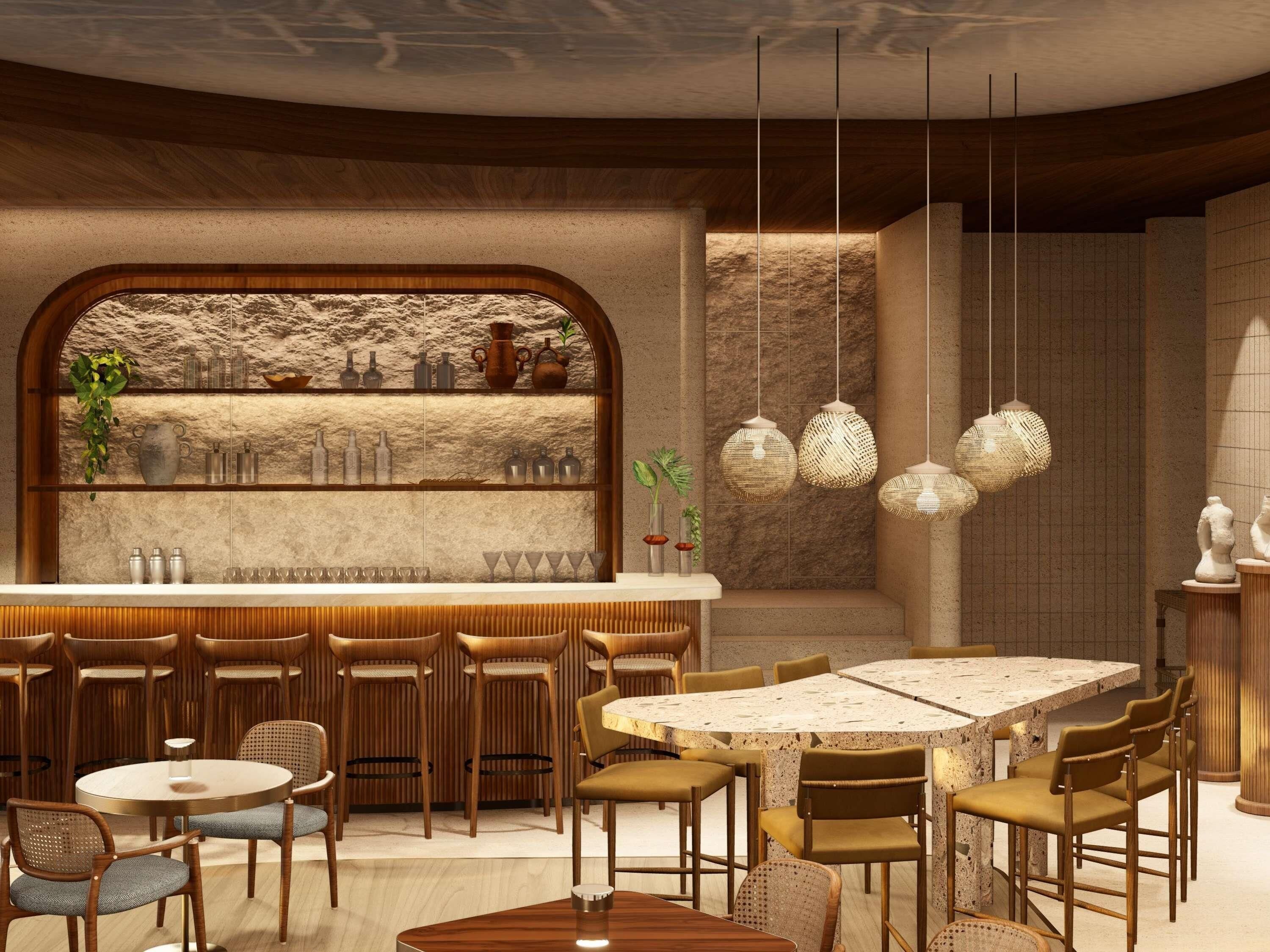 Interior de restaurante com área de bar, disposição de assentos e luminárias pendentes.