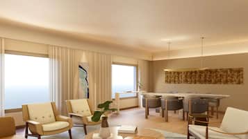 A modern hotel room with a dining area, large windows, and a view.