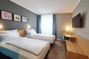 Hypo-allergenic bedding, desk, blackout drapes, soundproofing