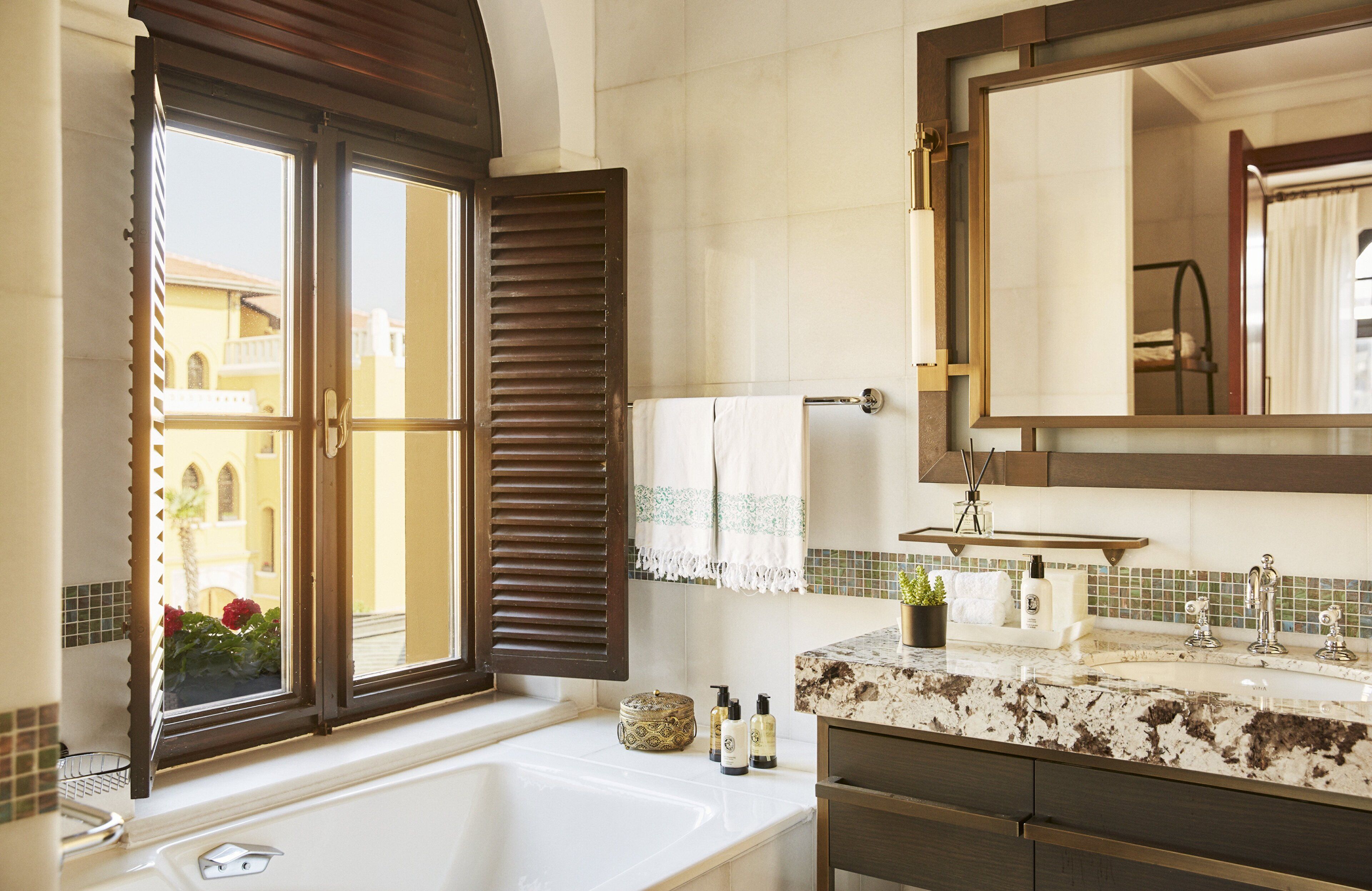 executive suite, 1 king bed, non smoking | bathroom | separate bathtub and shower, designer toiletries, hair dryer, bathrobes