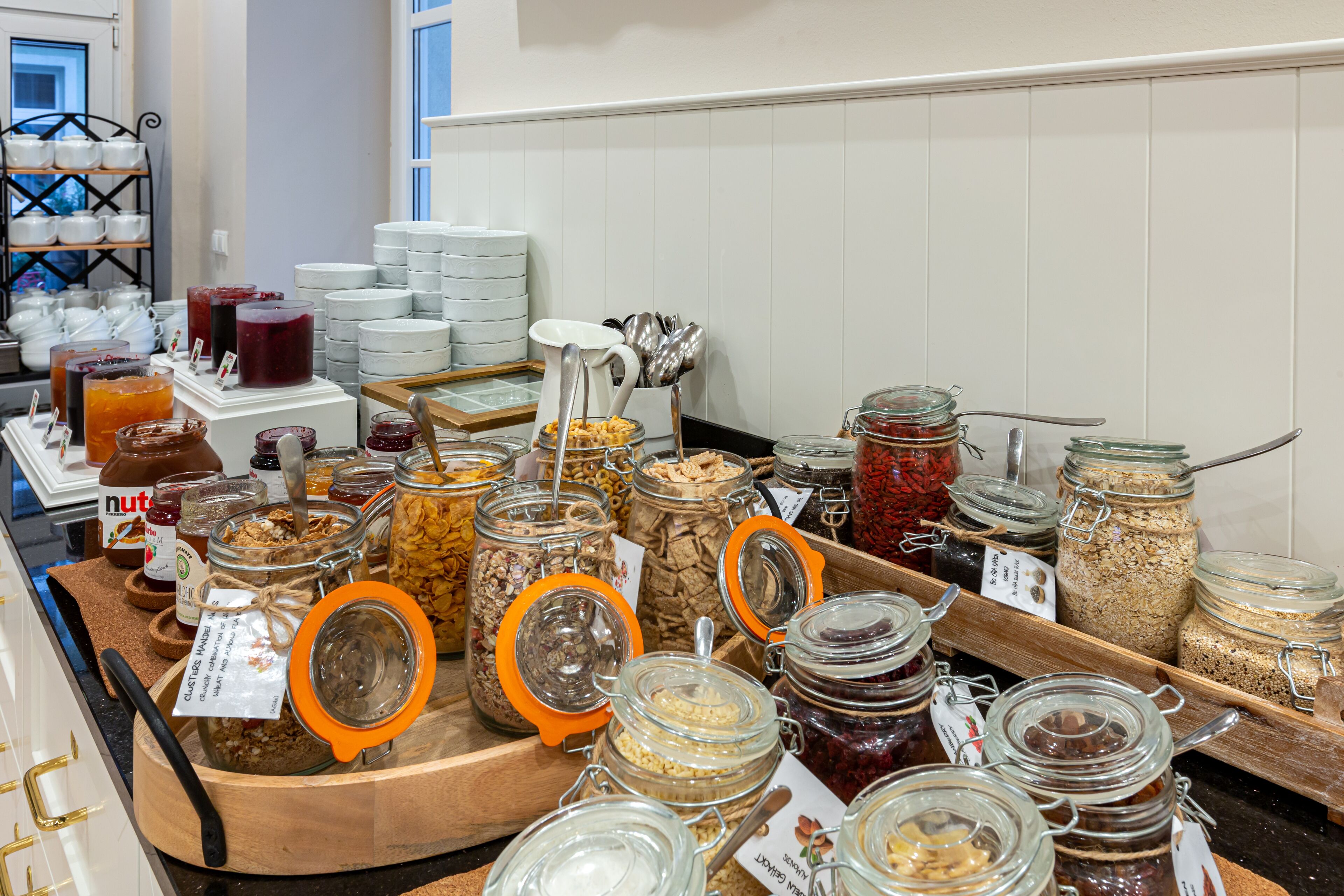 A breakfast buffet with various food items and condiments.