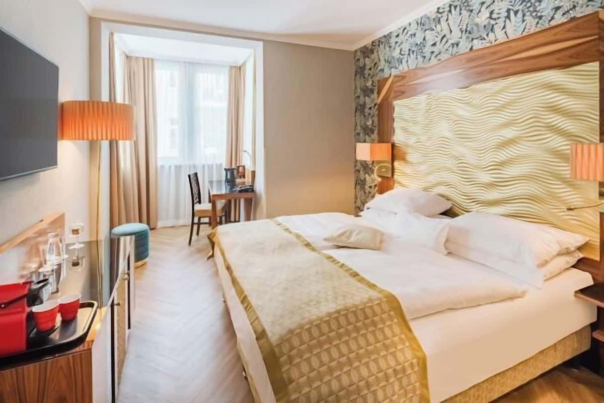 Premium bedding, pillow-top beds, in-room safe, individually decorated