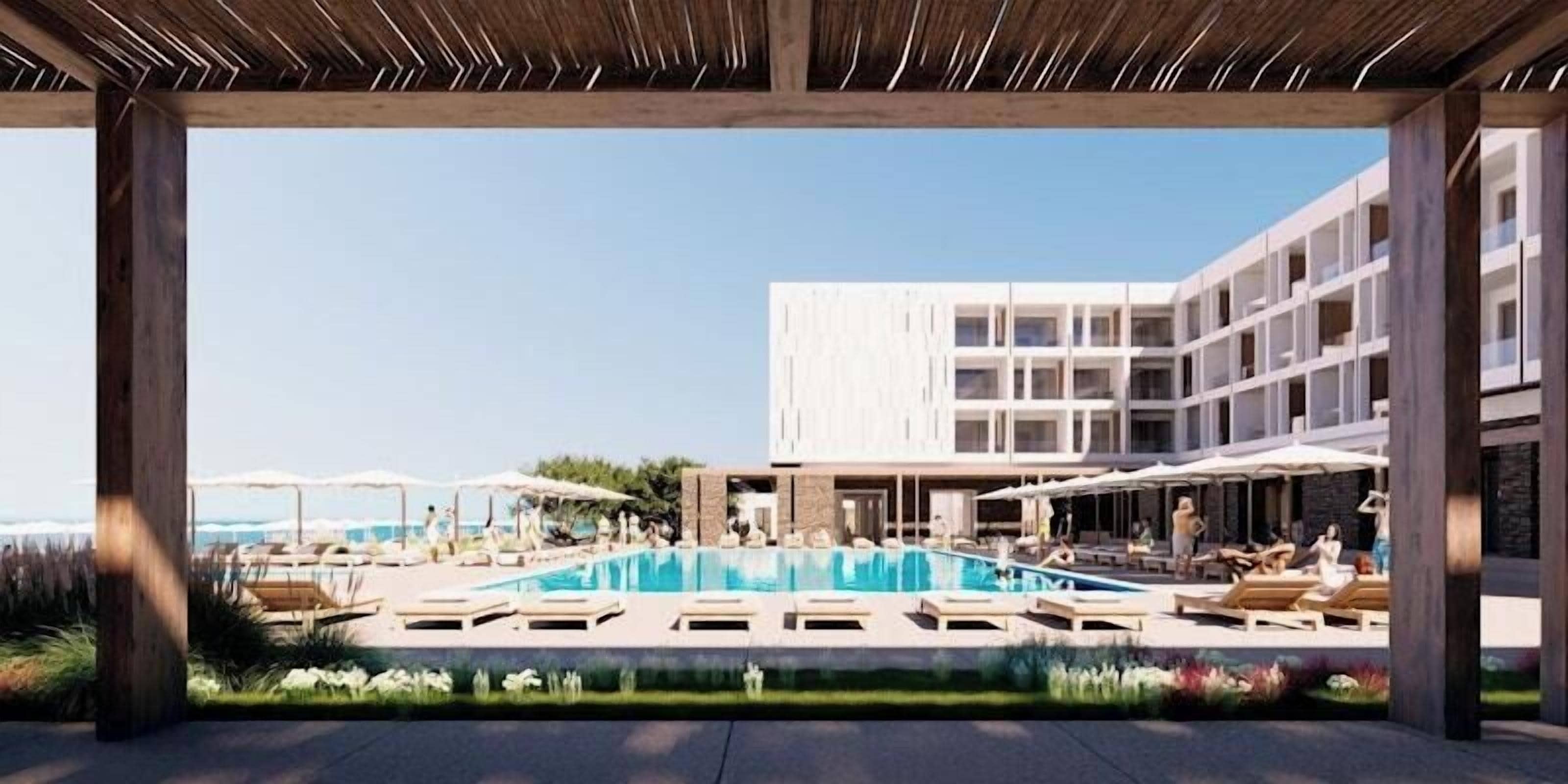 A modern hotel with a swimming pool, lounge chairs, and a covered outdoor area.