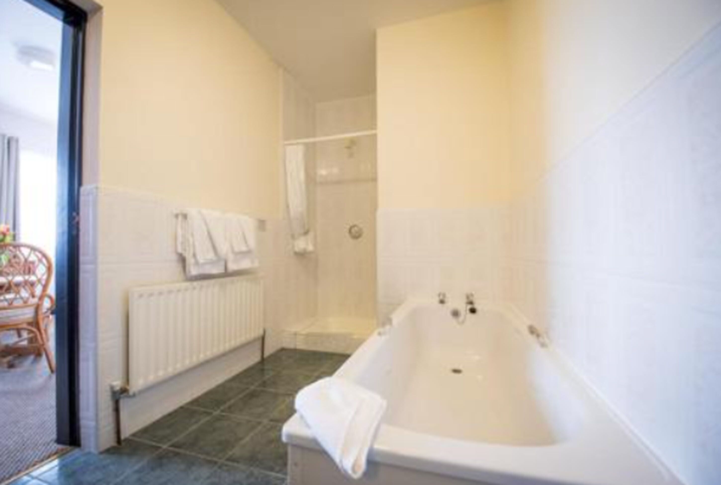 bathtub, hair dryer, towels