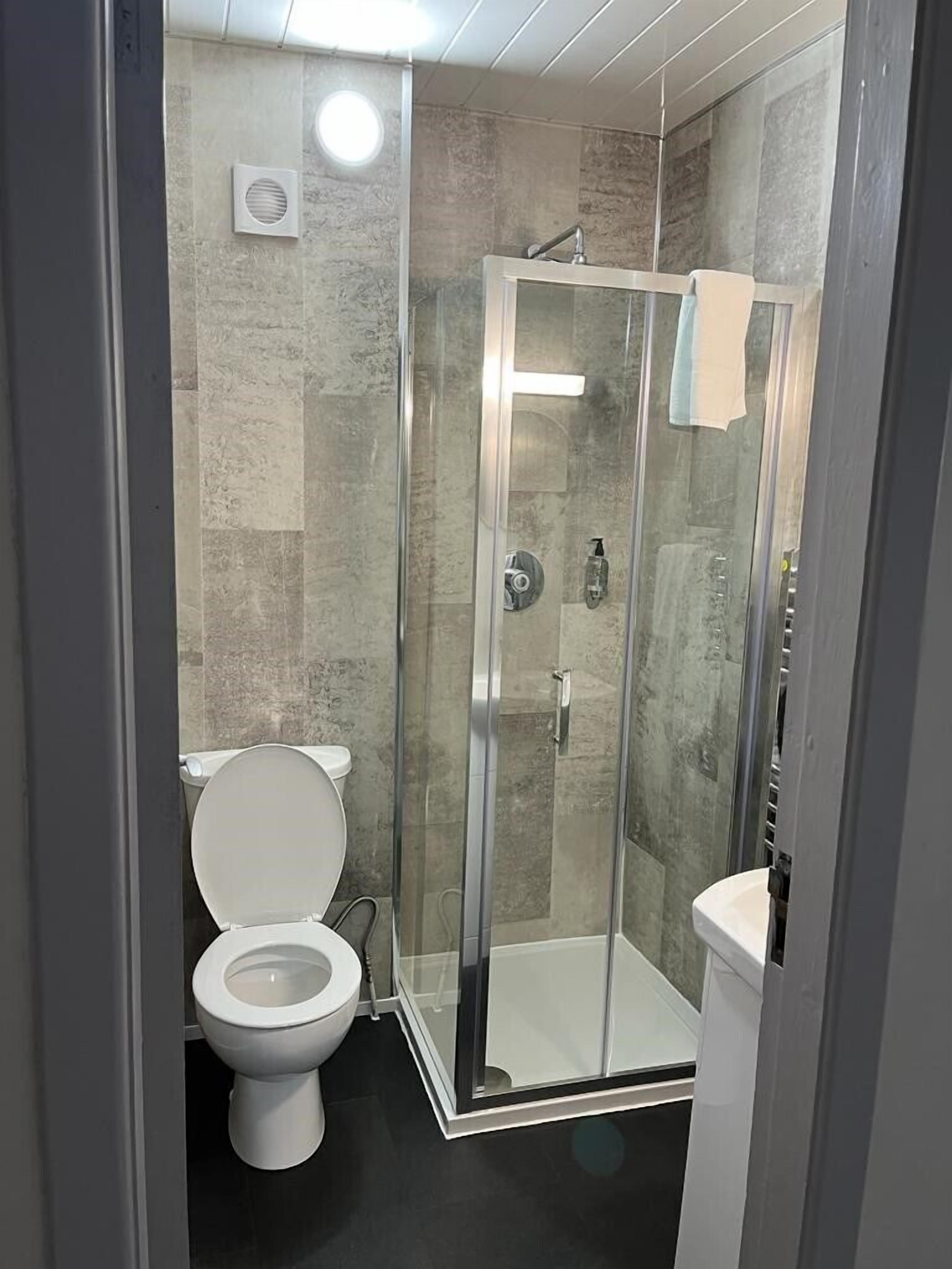 bathtub, hair dryer, towels