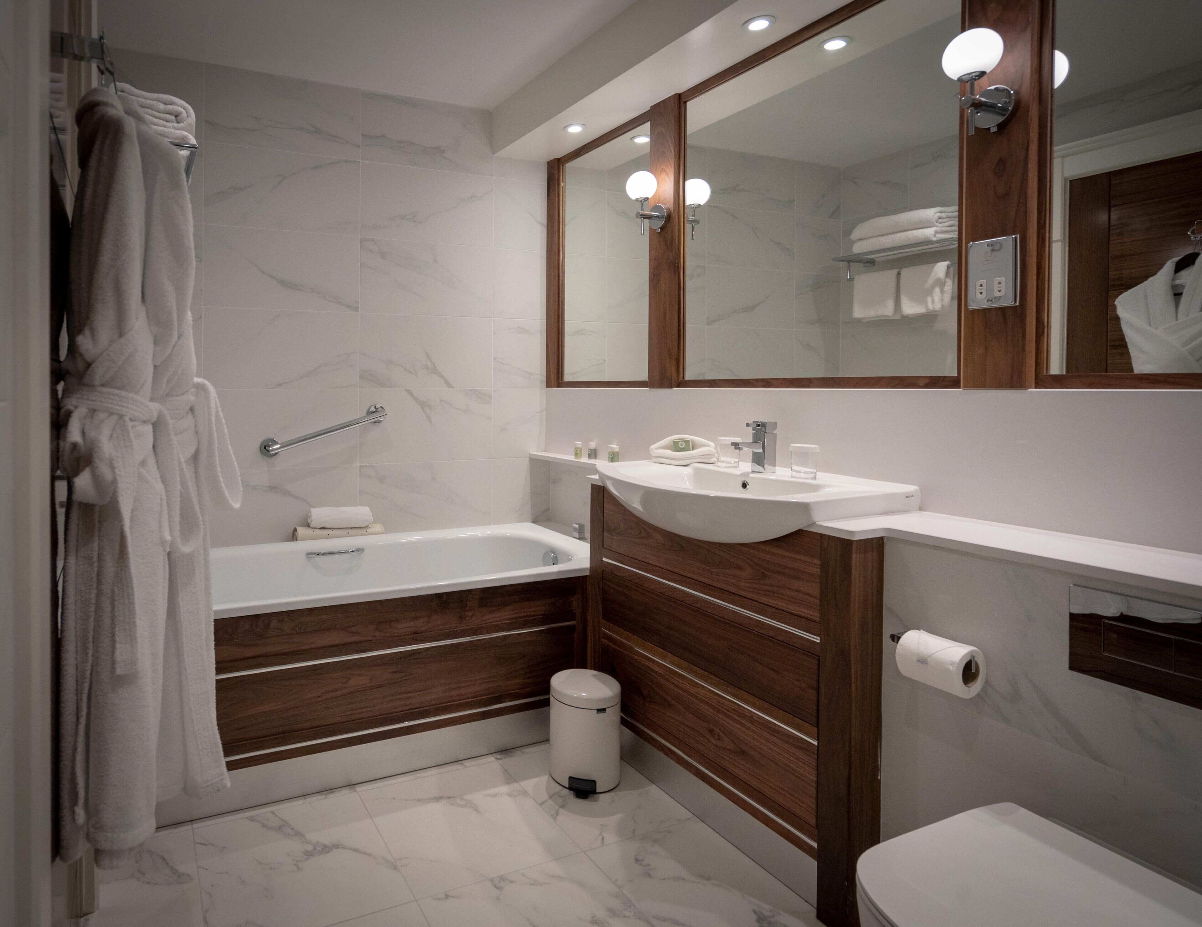 superior waterfront room (adult only) | bathroom | bathtub, free toiletries, hair dryer, bathrobes