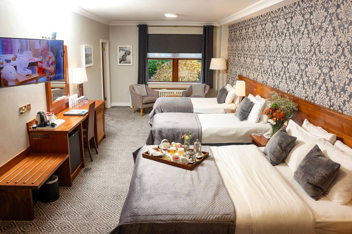 family room | 1 bedroom, premium bedding, in-room safe, desk