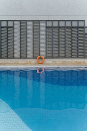 Outdoor pool, pool umbrellas, sun loungers