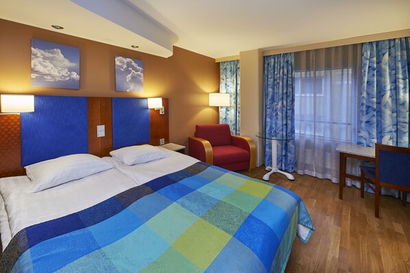 Minibar, desk, blackout curtains, iron/ironing board