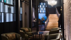 A spacious lobby with leather sofas, a grand staircase, and a chandelier. - Avon Gorge by Hotel du Vin (Bristol)