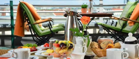 Breakfast, lunch served; international cuisine, al fresco dining