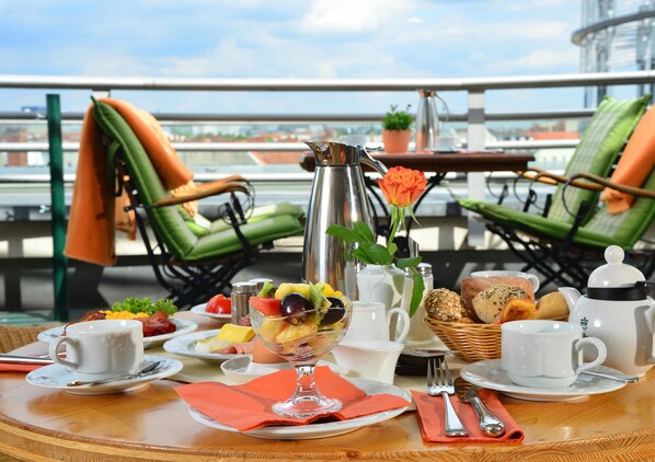 Breakfast, lunch served; international cuisine, al fresco dining 