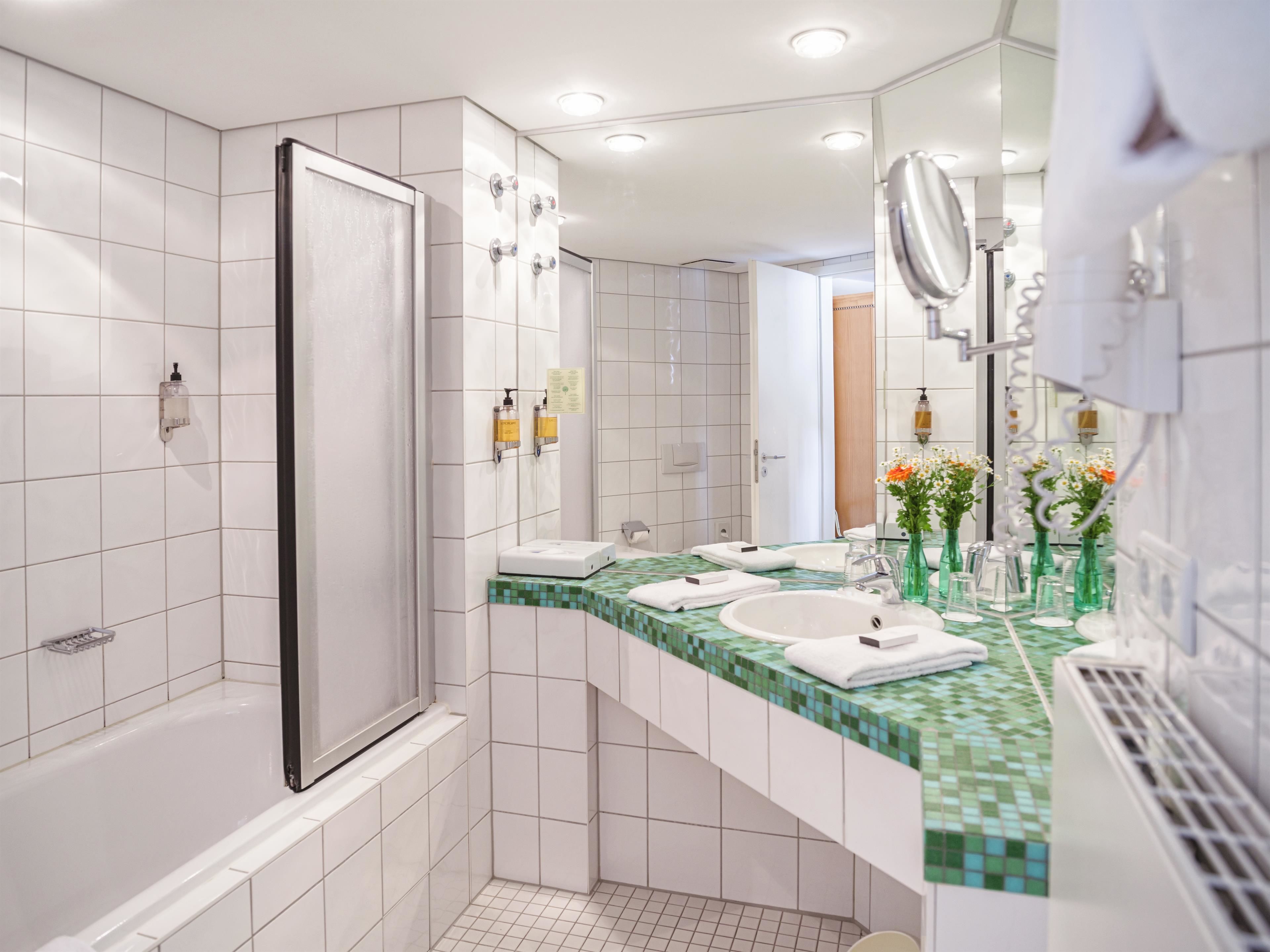 eco-friendly toiletries, hair dryer, towels