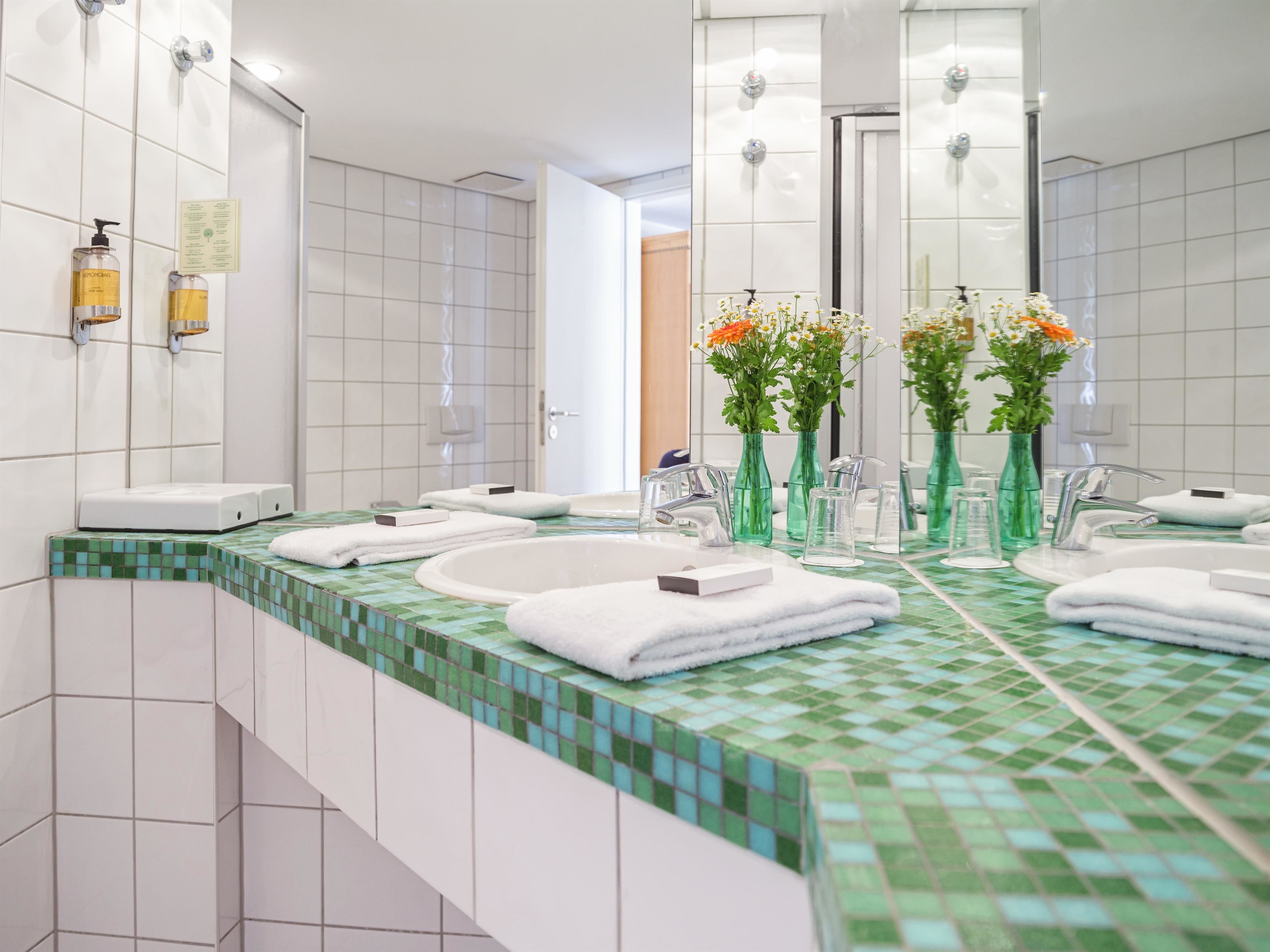 eco-friendly toiletries, hair dryer, towels