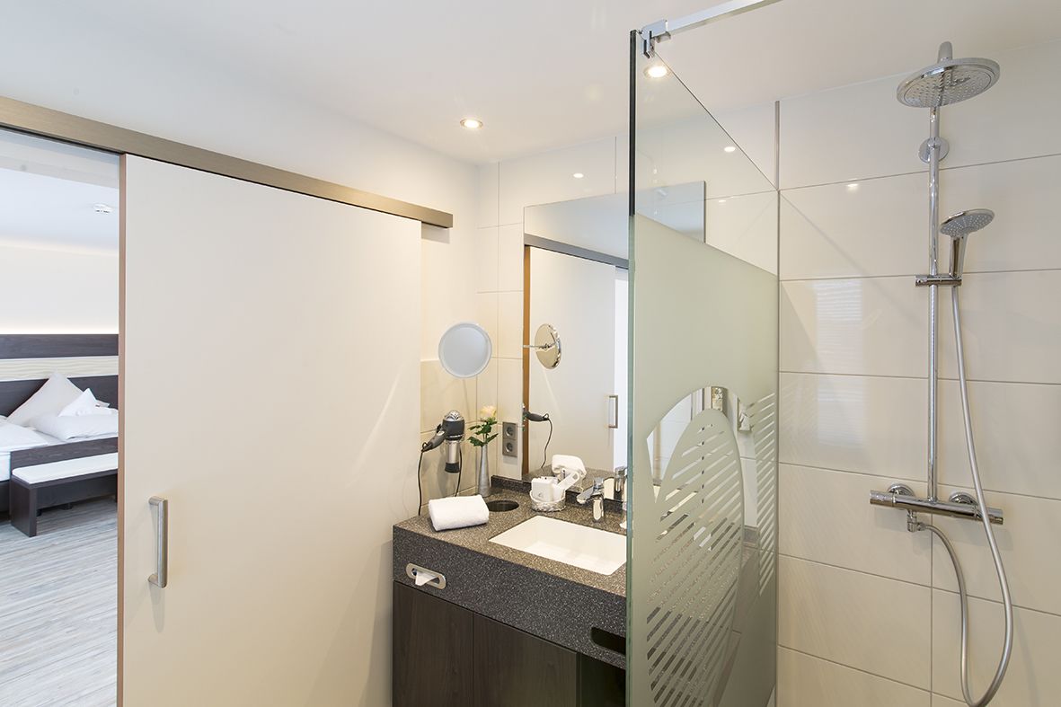 superior double room | bathroom | hair dryer, towels, soap, shampoo