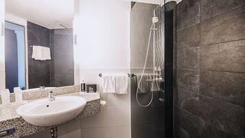 Combined shower/tub, free toiletries, hair dryer, bathrobes