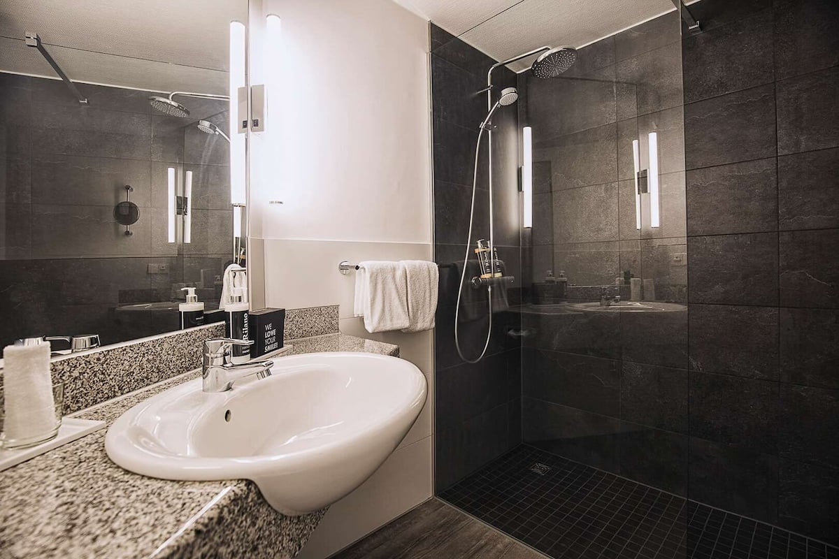 combined shower/bathtub, free toiletries, hair dryer, bathrobes