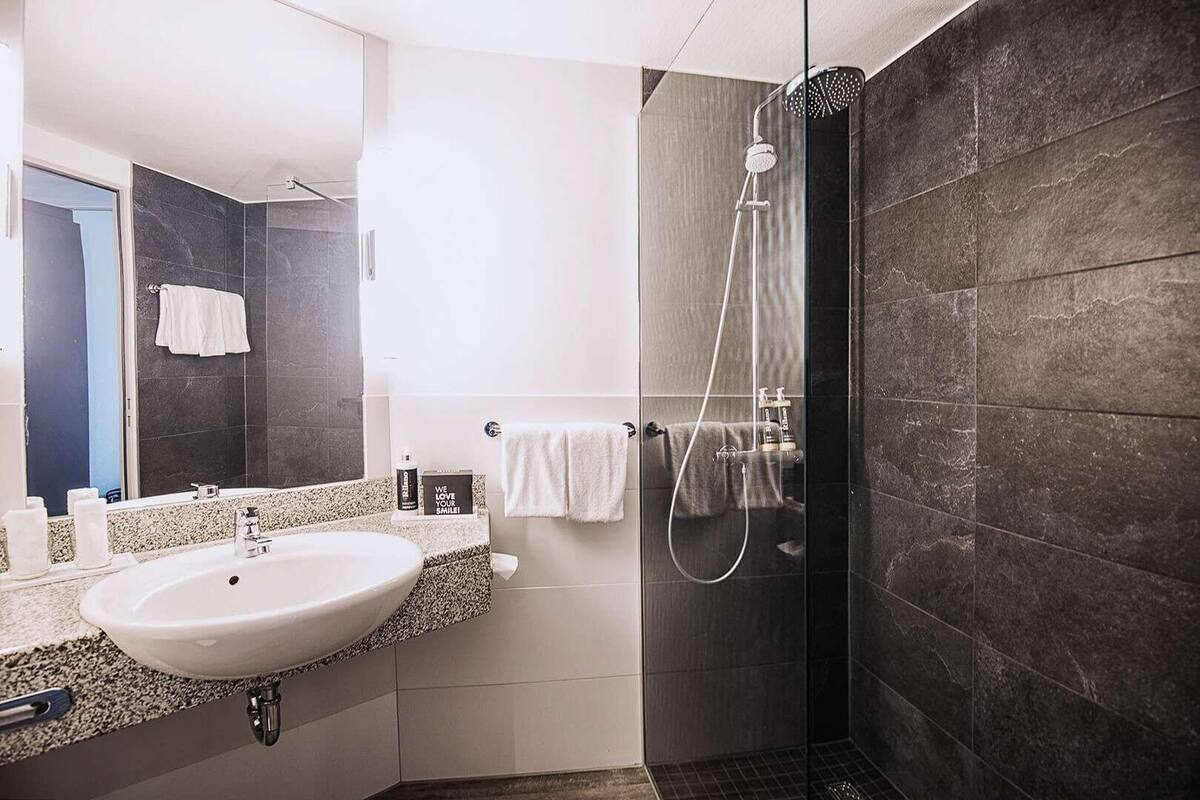 combined shower/bathtub, free toiletries, hair dryer, bathrobes