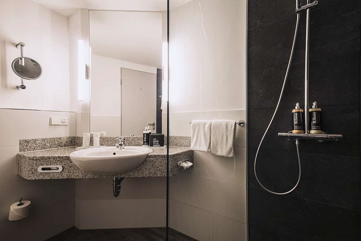 combined shower/bathtub, free toiletries, hair dryer, bathrobes