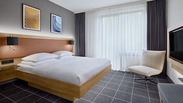 Hypo-allergenic bedding, desk, laptop workspace, blackout curtains