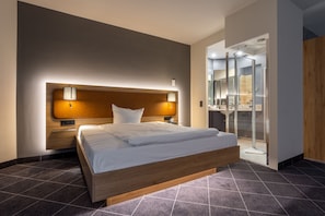 Hypo-allergenic bedding, desk, laptop workspace, blackout drapes