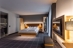 Hypo-allergenic bedding, desk, laptop workspace, blackout drapes