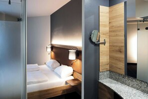 Hypo-allergenic bedding, desk, laptop workspace, blackout curtains