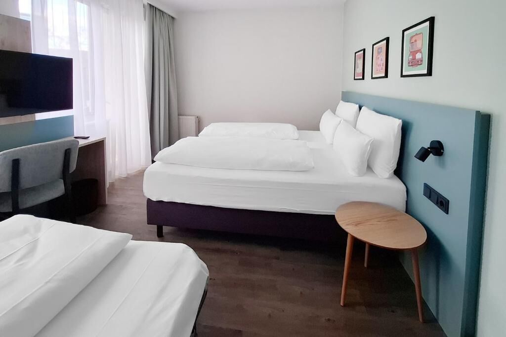 Chambre triple Standard | Coffre-fort, bureau, rideaux d’obscurcissement, système d’insonorisation