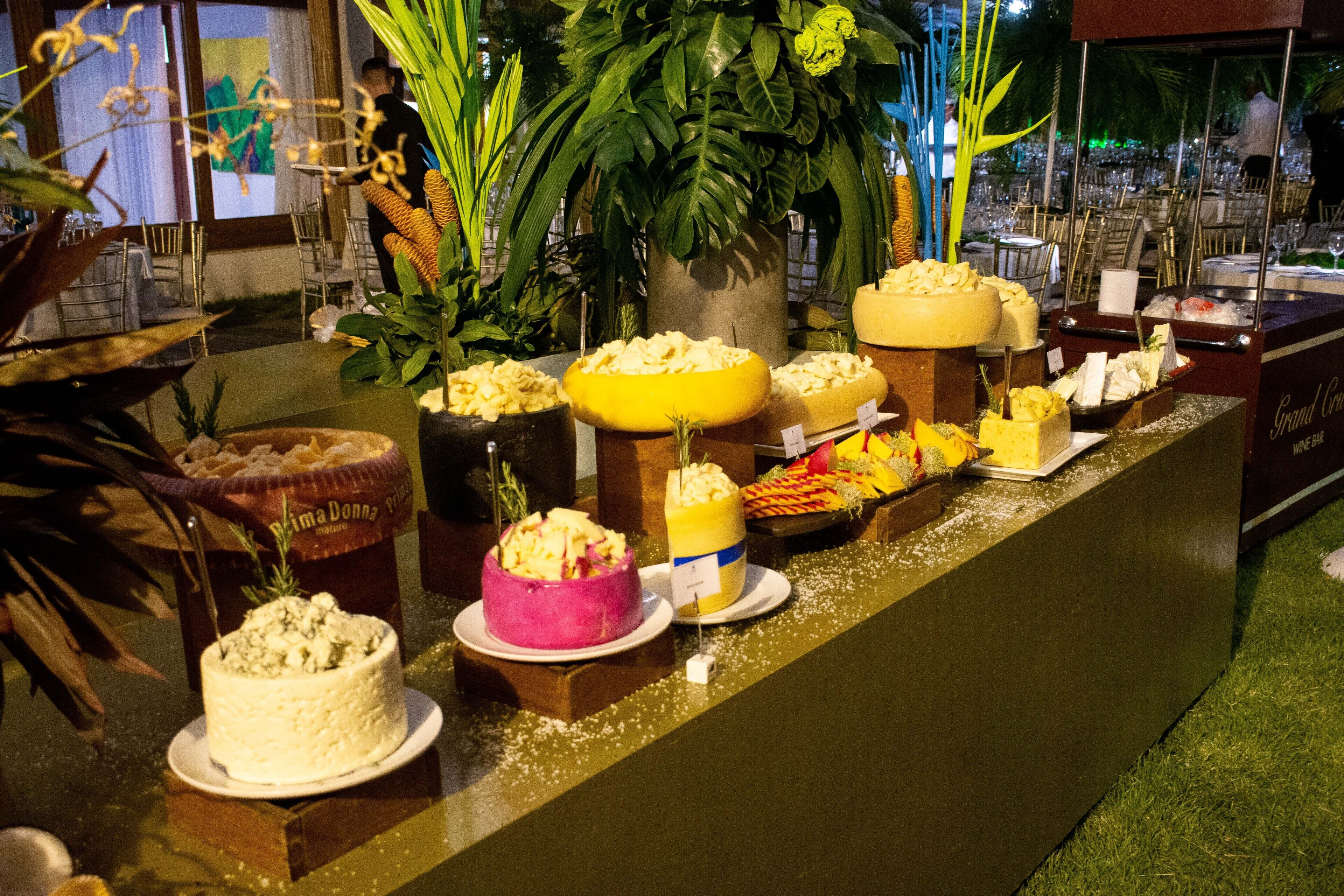 A buffet with various food items and a cake on display.