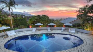 Outdoor pool, open 6:00 AM to 8:00 PM, free cabanas, pool umbrellas