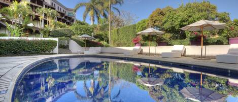 Outdoor pool, open 6:00 AM to 8:00 PM, free cabanas, pool umbrellas