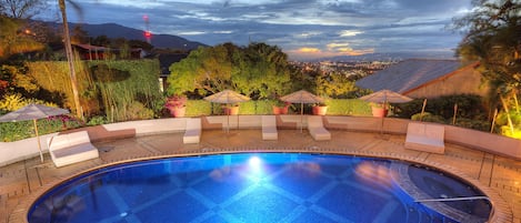 Outdoor pool, open 6:00 AM to 8:00 PM, free cabanas, pool umbrellas