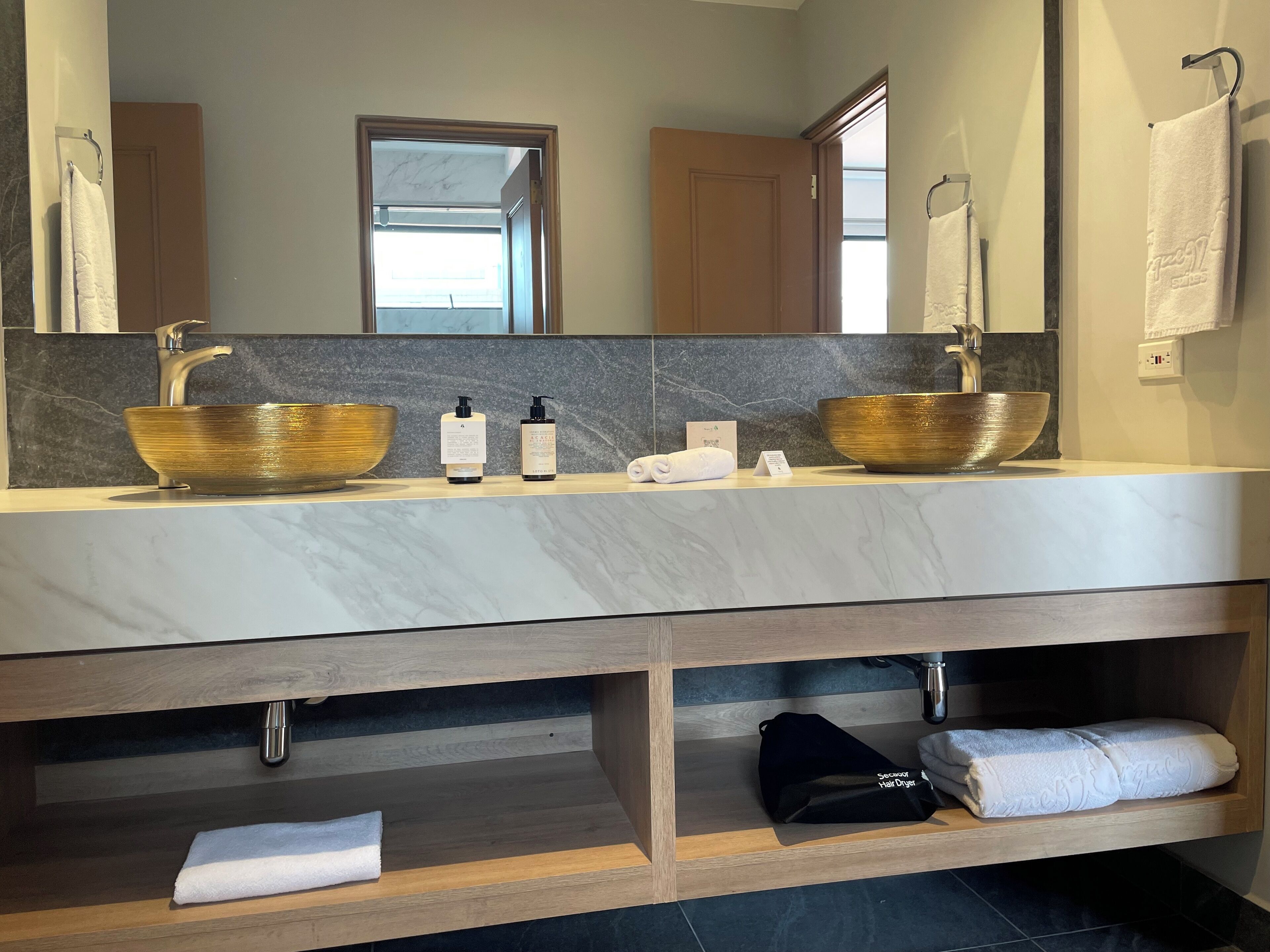 junior suite | bathroom | shower, rainfall showerhead, hair dryer, towels