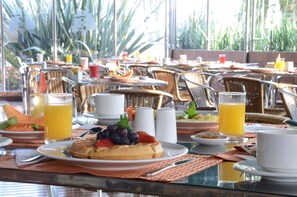 Daily buffet breakfast (USD 12 per person)