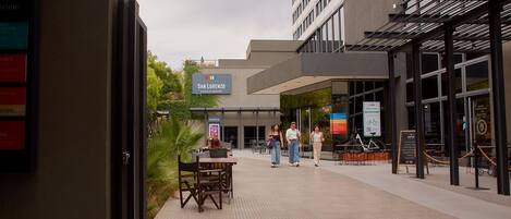A modern building with a sign reading "SAN LORENZO ESPACIO URBANO".
