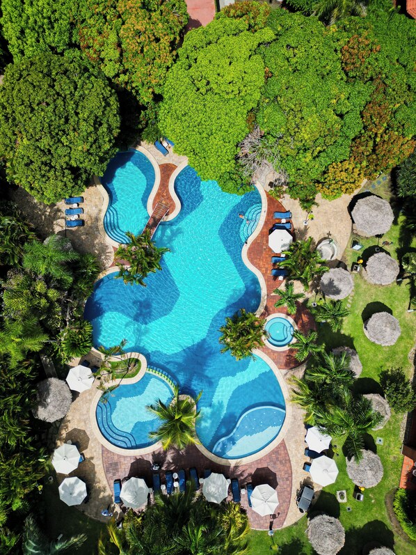 Indoor pool, outdoor pool, pool umbrellas