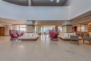 Relax in our spacious lobby with comfortable seating and a stunning city view.