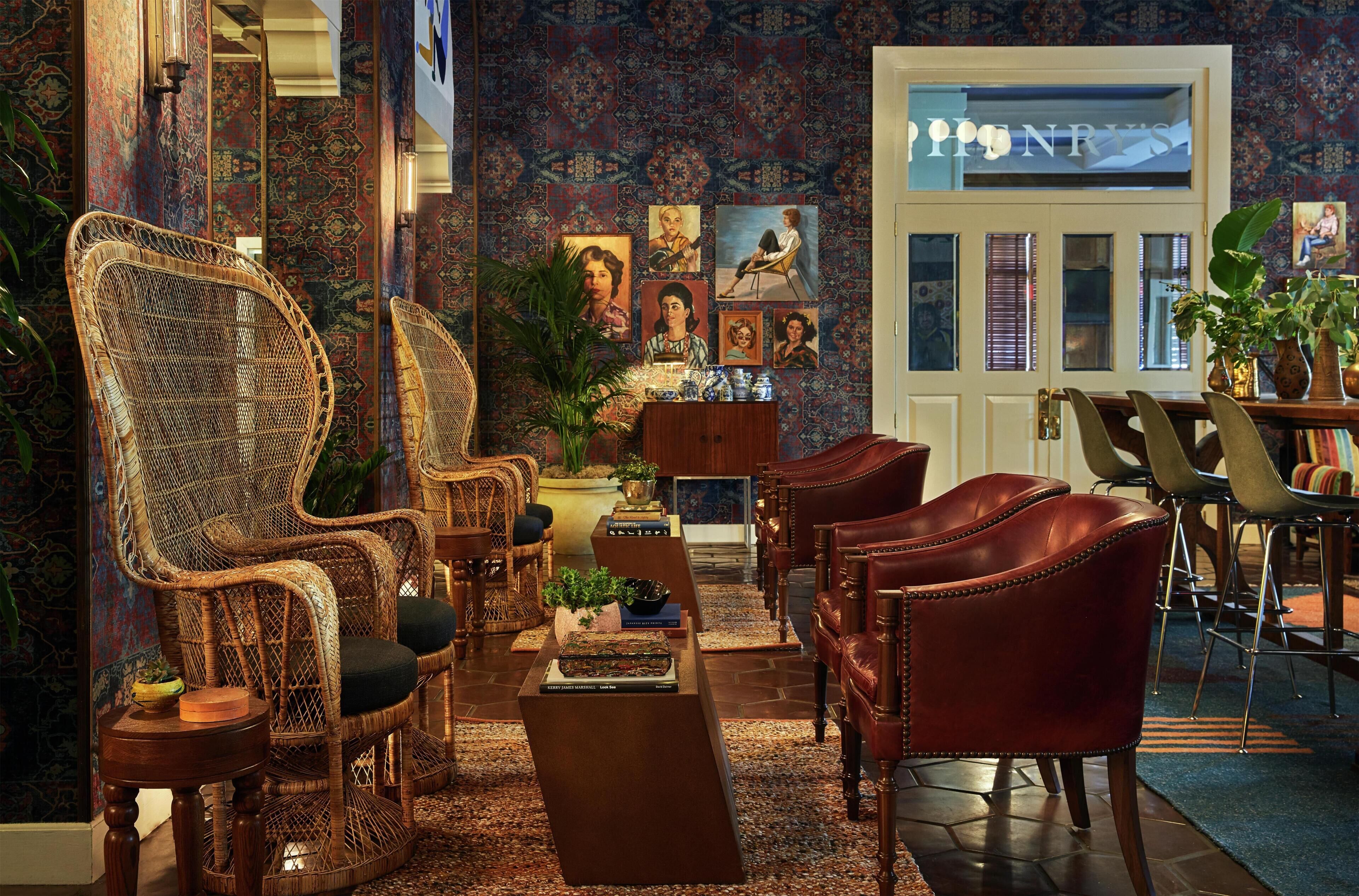A traditional room with a sofa, chairs, a coffee table, and a dining area.