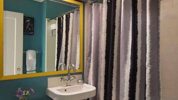 Designer toiletries, hair dryer, towels