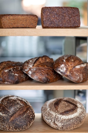 A bakery display with various types of bread.
