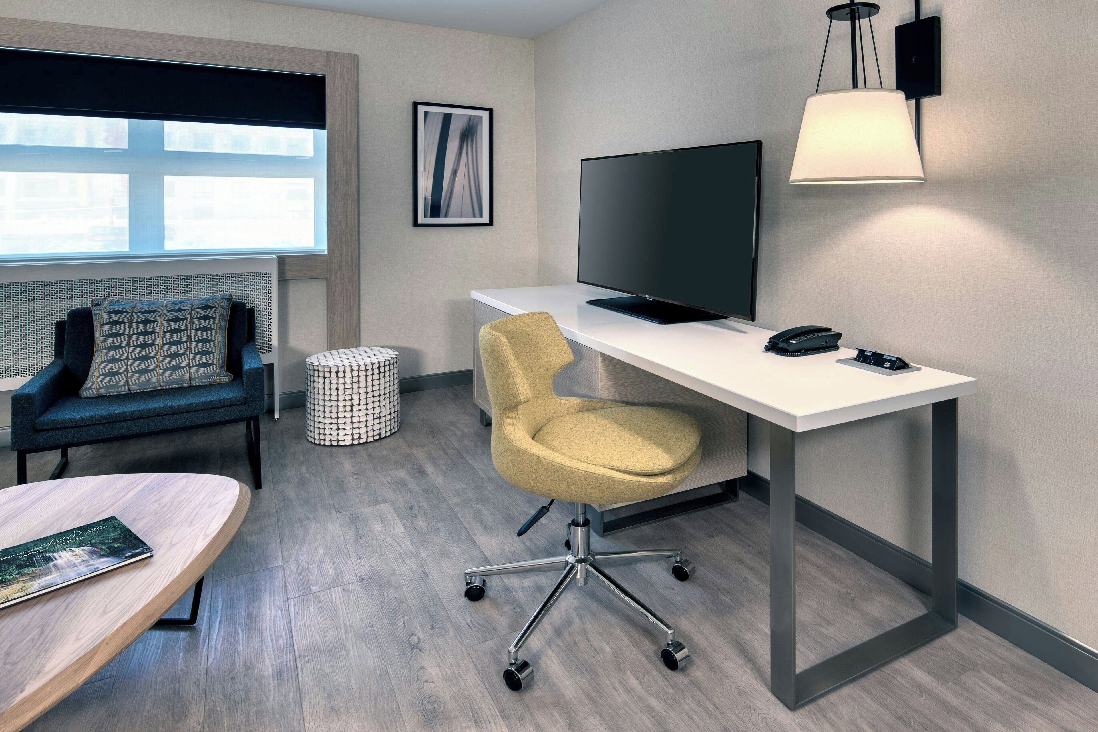 junior suite, 1 bedroom | living area | 49-inch tv with cable channels, netflix, ipod dock