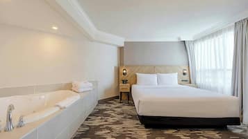 Jacuzzi Suite, 1 King Bed, Sofa Bed | 1 bedroom, premium bedding, pillow-top beds, in-room safe