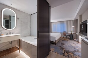 Separate tub and shower, rainfall showerhead, free toiletries
