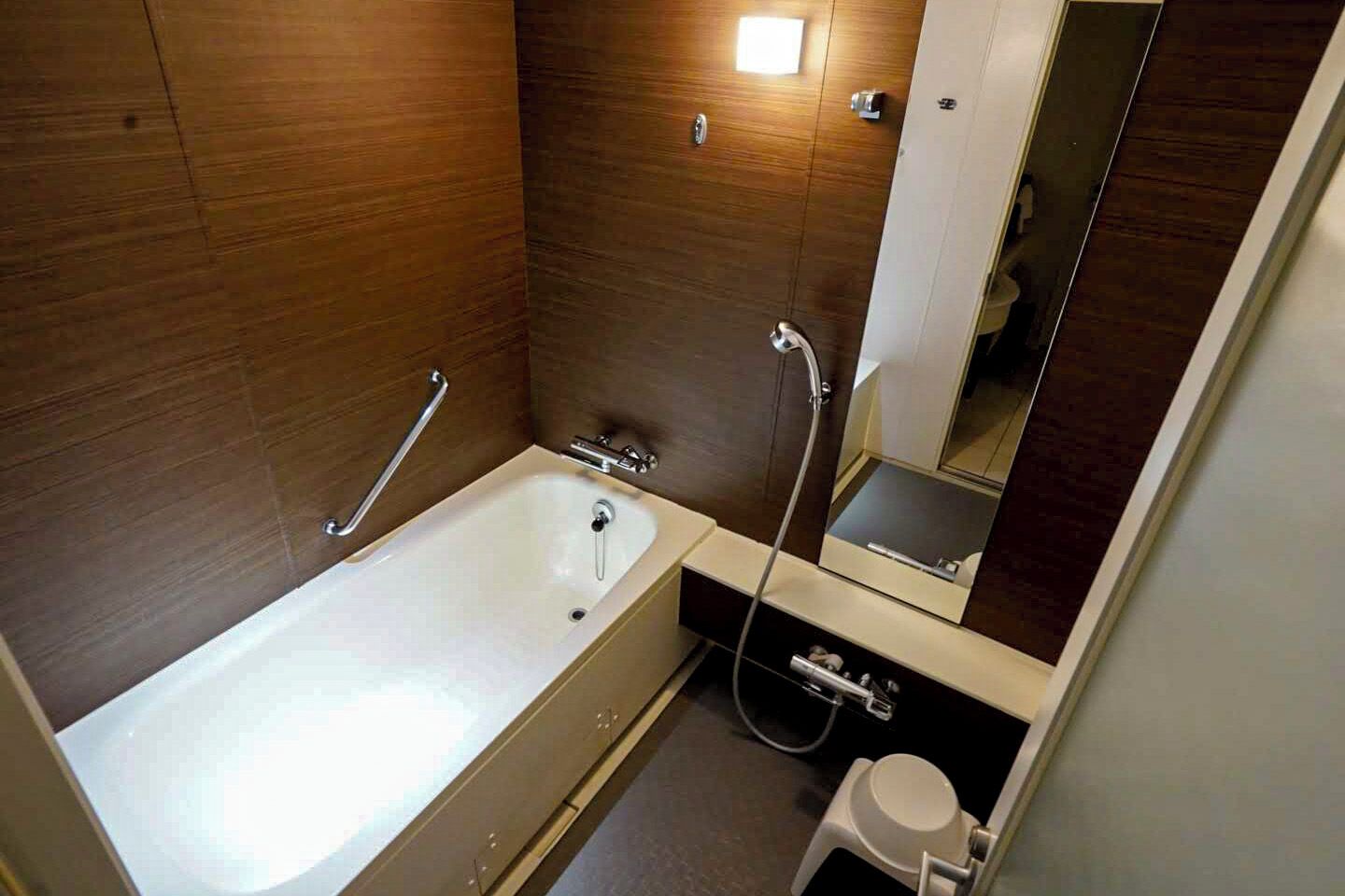 hair dryer, slippers, electronic bidet, towels