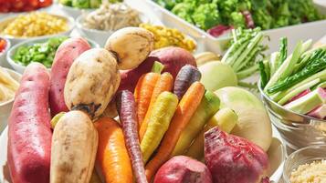 A variety of vegetables including carrots, potatoes, and beets.