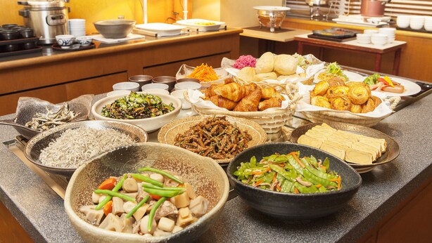 A buffet with various dishes including noodles, vegetables, and pastries. - Matsuyama Tokyu REI Hotel (Matsuyama)
