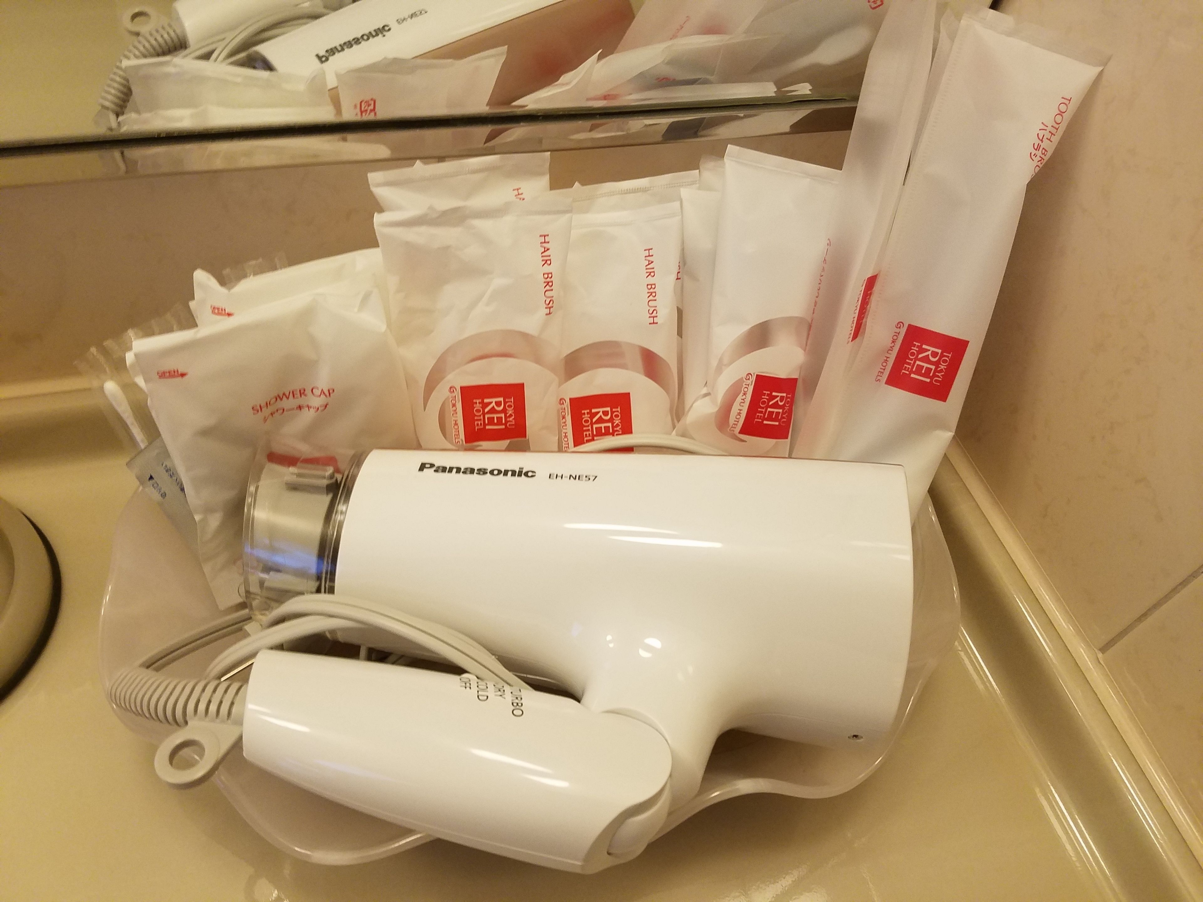 combined shower/bathtub, free toiletries, hair dryer, slippers