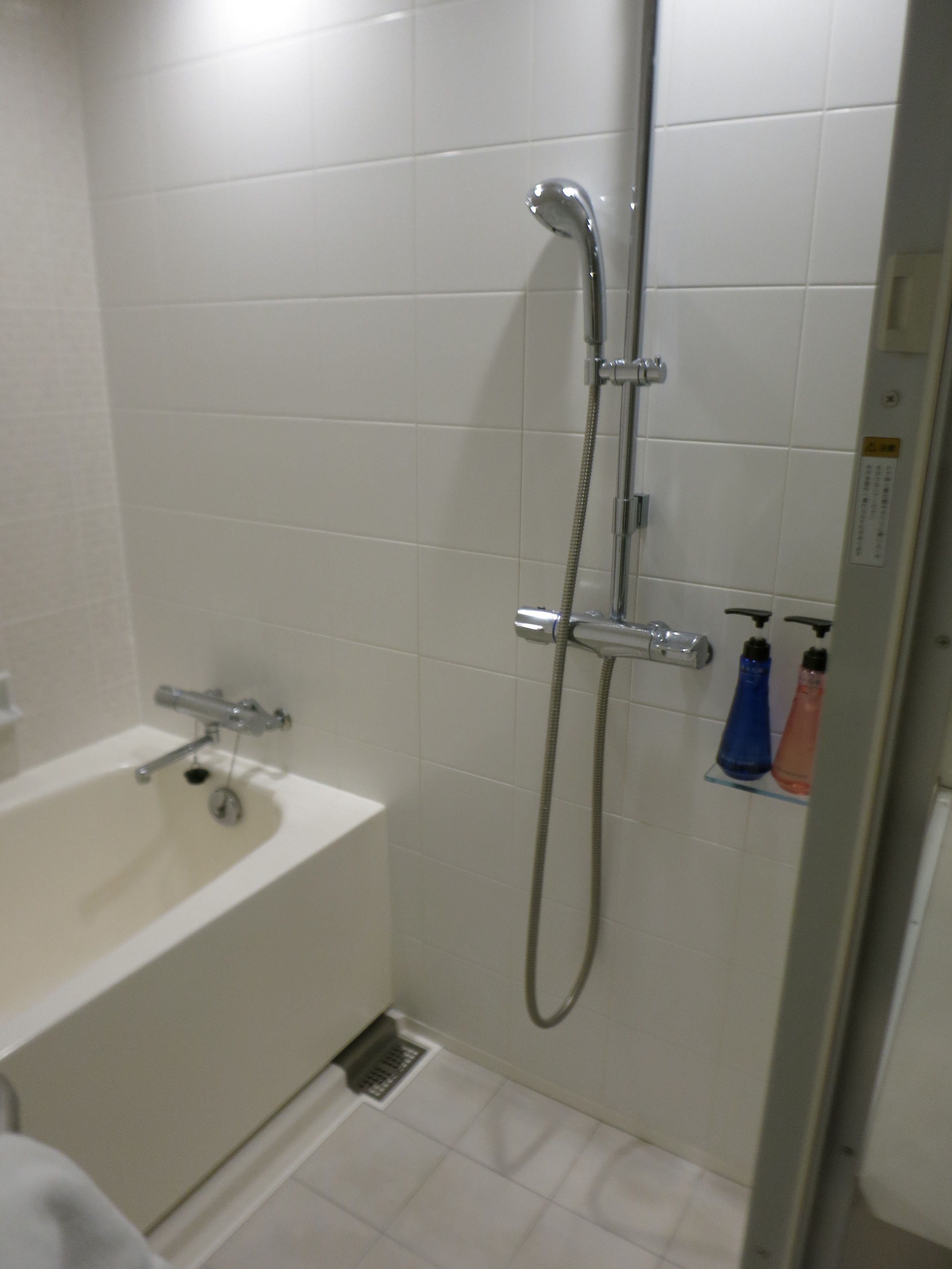 A bathroom with a bathtub, a shower, and a toilet.